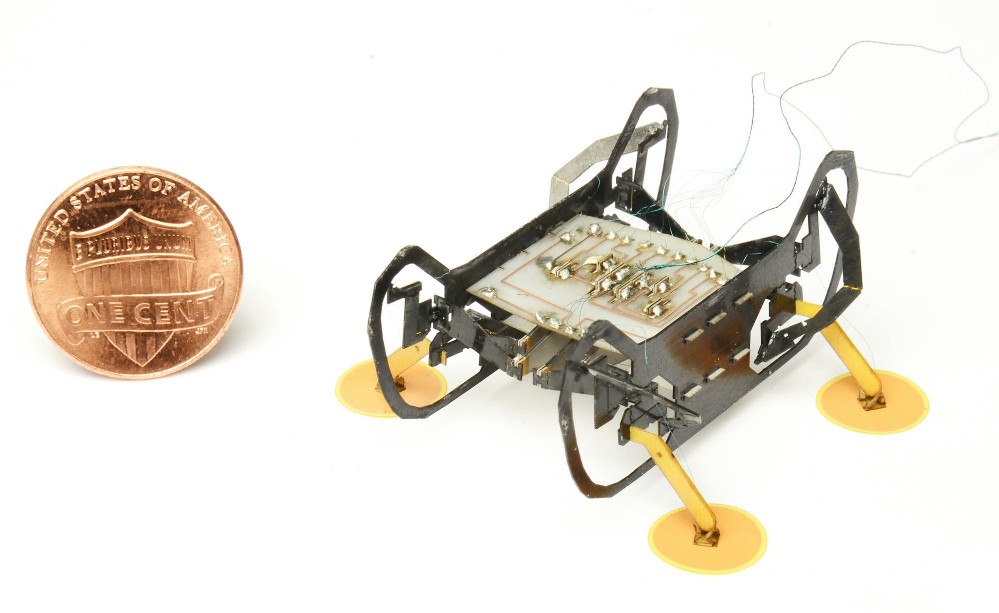 HAMR-E prototype beside a coin for scale.