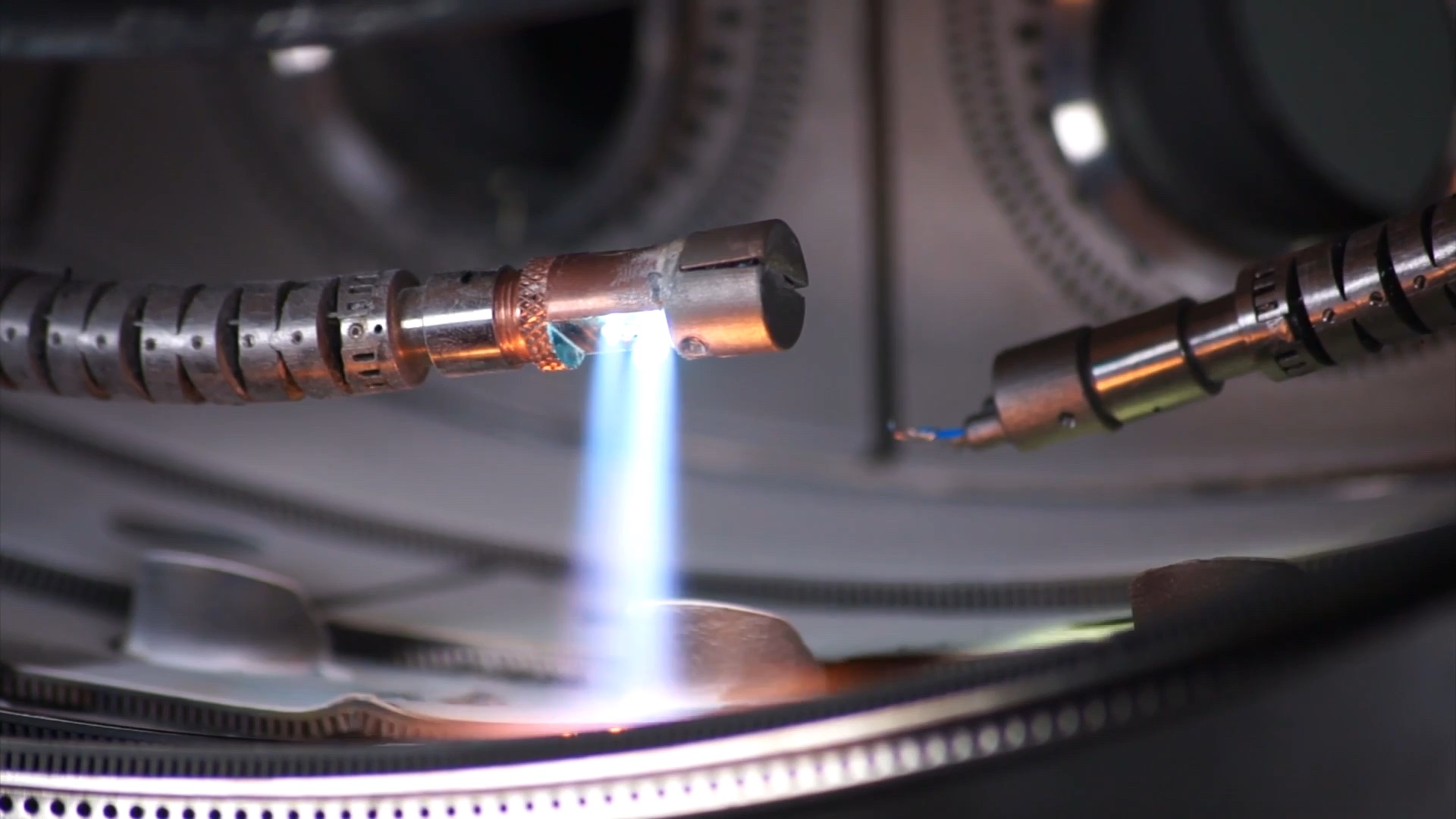 Official video frame: FLARE snake tips during a combustor flame-spray experiment (01:50).